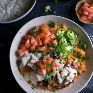 Chipotle Chicken and White Queso Cheese Sauce served in a big bowl with rice on the side