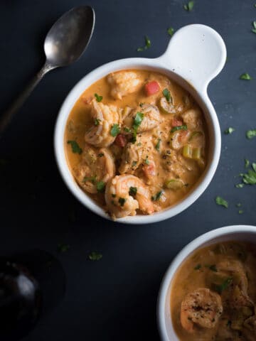 Overhead on a big bowl of Creamy Seafood Stew with another bowl in the bottom of the frame