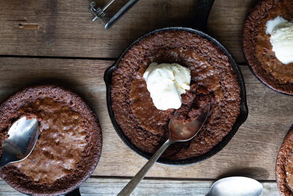 Chewy and Fudgy Toffee Brownies looking extra inviting with a dollop of ice cream on top