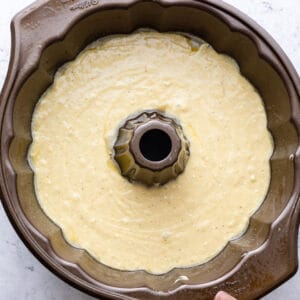 Placing cake mix in the greased bundt cake pan