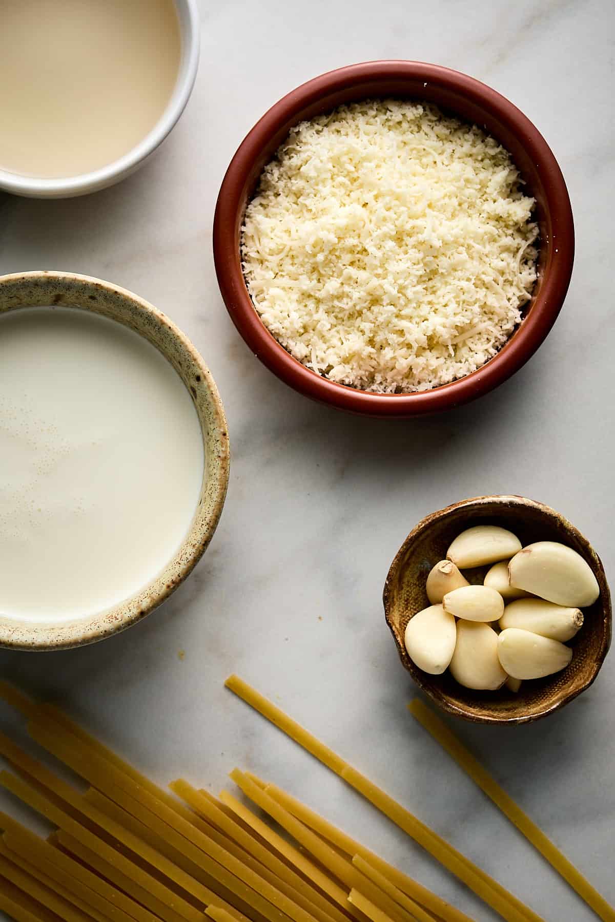Bowls of Ingredients and Uncooked Pasta