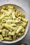 bowls of pasta cheese and pesto