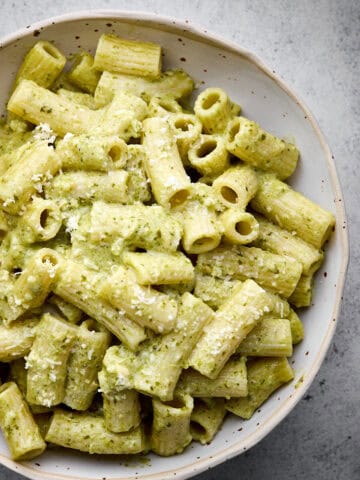 bowls of pasta cheese and pesto