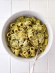 Creamy Pesto Pasta in White Bowl on White Table Top