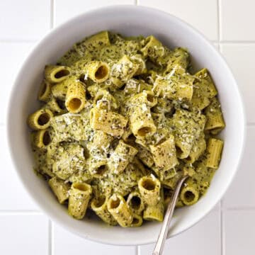 Creamy Pesto Pasta in White Bowl on White Table Top