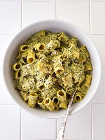 Creamy Pesto Pasta in White Bowl on White Table Top