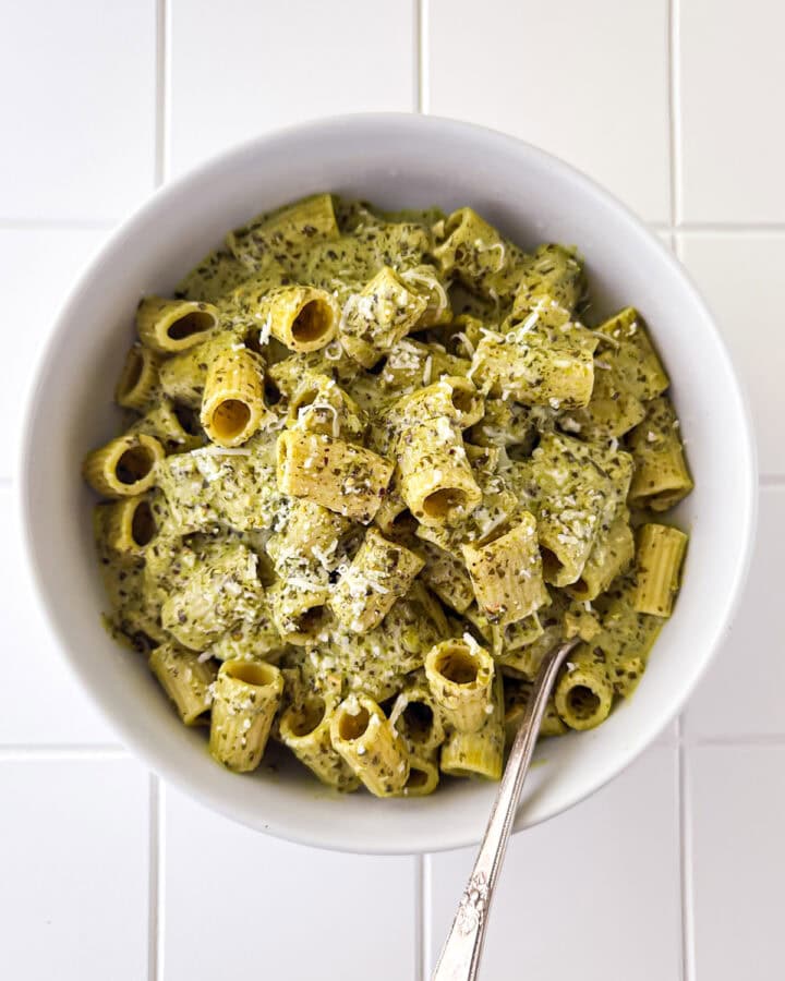 Creamy Pesto Pasta in White Bowl on White Table Top