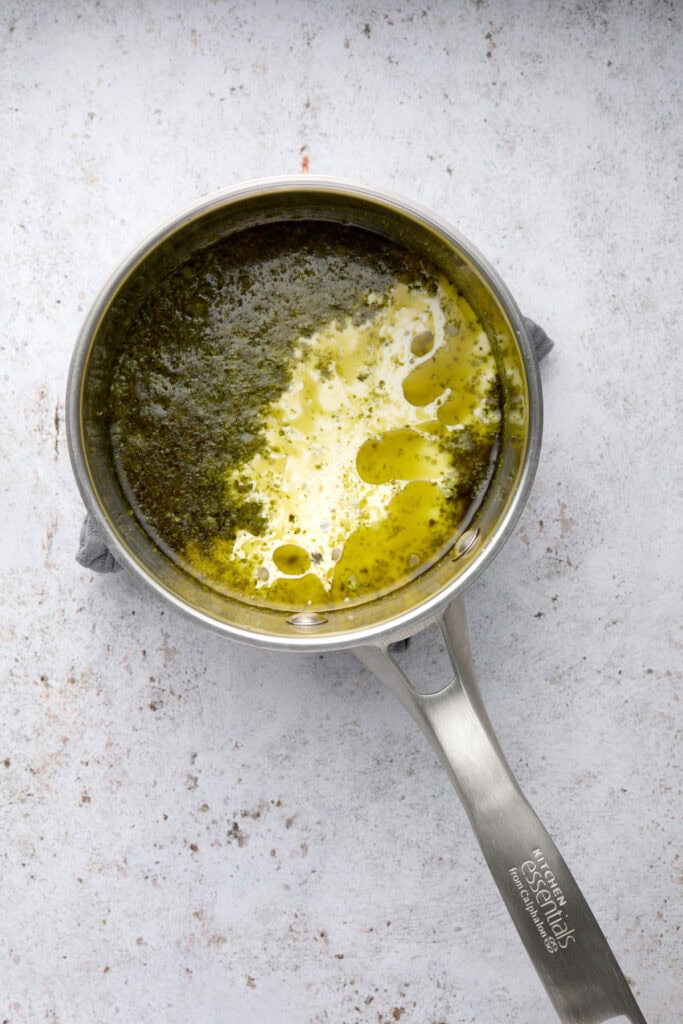 small pan of pesto heavy cream and garlic