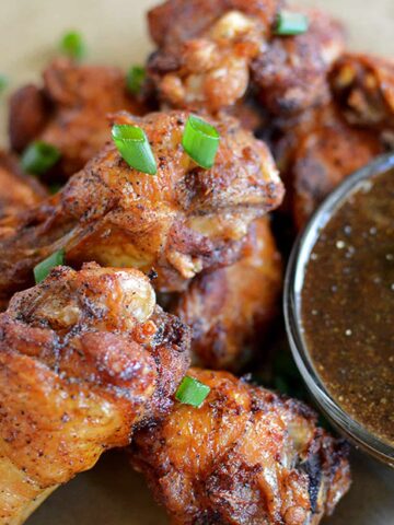 Crispy Chinese Black Pepper Chicken Wings served with a bowl of mouthwatering sauce