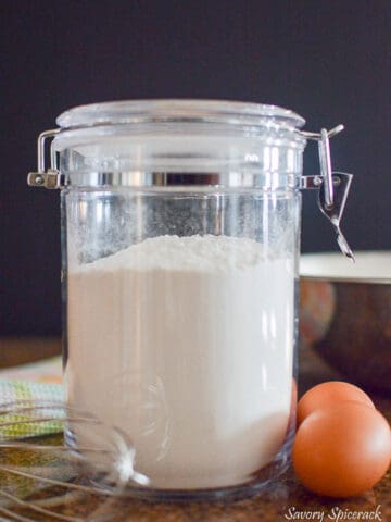 Fantastic closeup of the easy DIY waffle mix recipe with a wisk on the left side of the jar