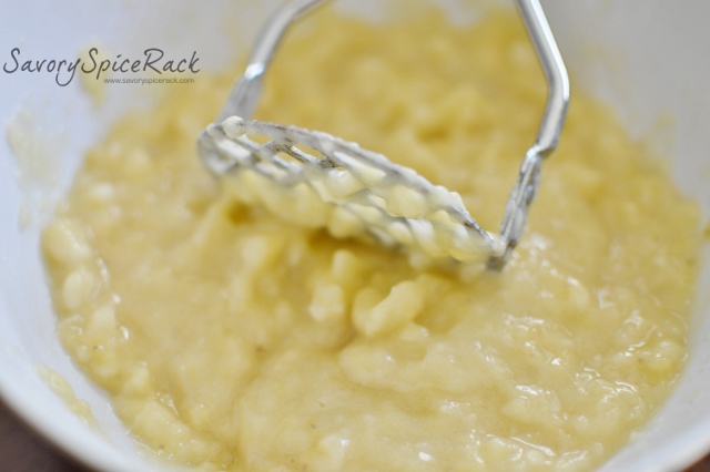 Using a masher to mash the overripe bananas