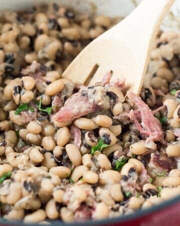 Spicy and Smoky Southern Black Eyed Peas in pot with spoon