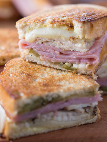 turkey cuban sandwiches on wooden board