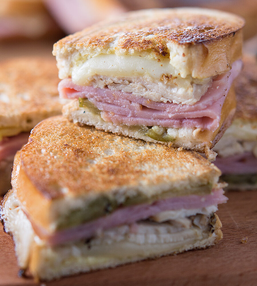 turkey cuban sandwiches on wooden board