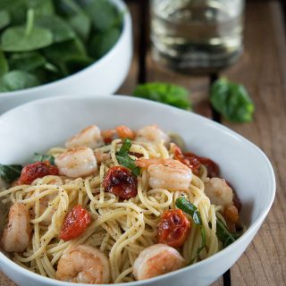 Shrimp and Roasted Tomato Pasta with Garlic Wine Sauce in white bowl