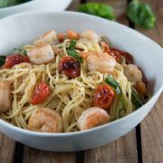 Shrimp and Roasted Tomato Pasta with Garlic Wine Sauce in white bowl