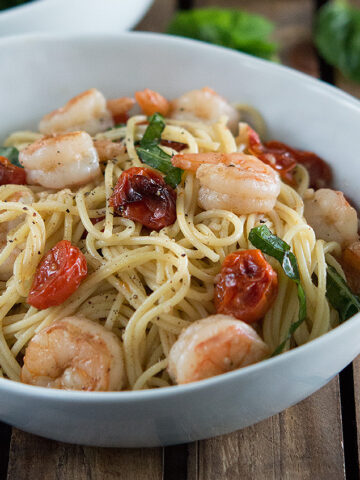 Shrimp and Roasted Tomato Pasta with Garlic Wine Sauce in white bowl