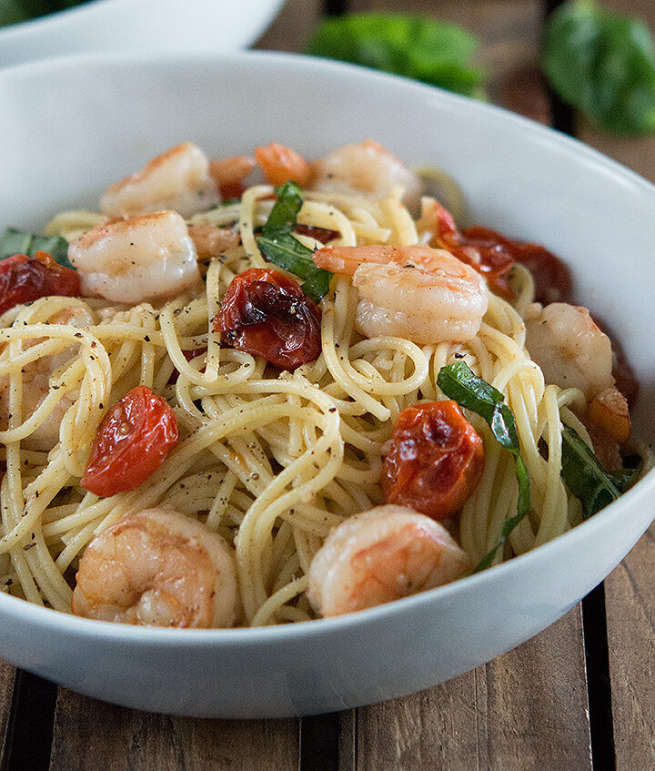 Shrimp and Roasted Tomato Pasta with Garlic Wine Sauce in white bowl