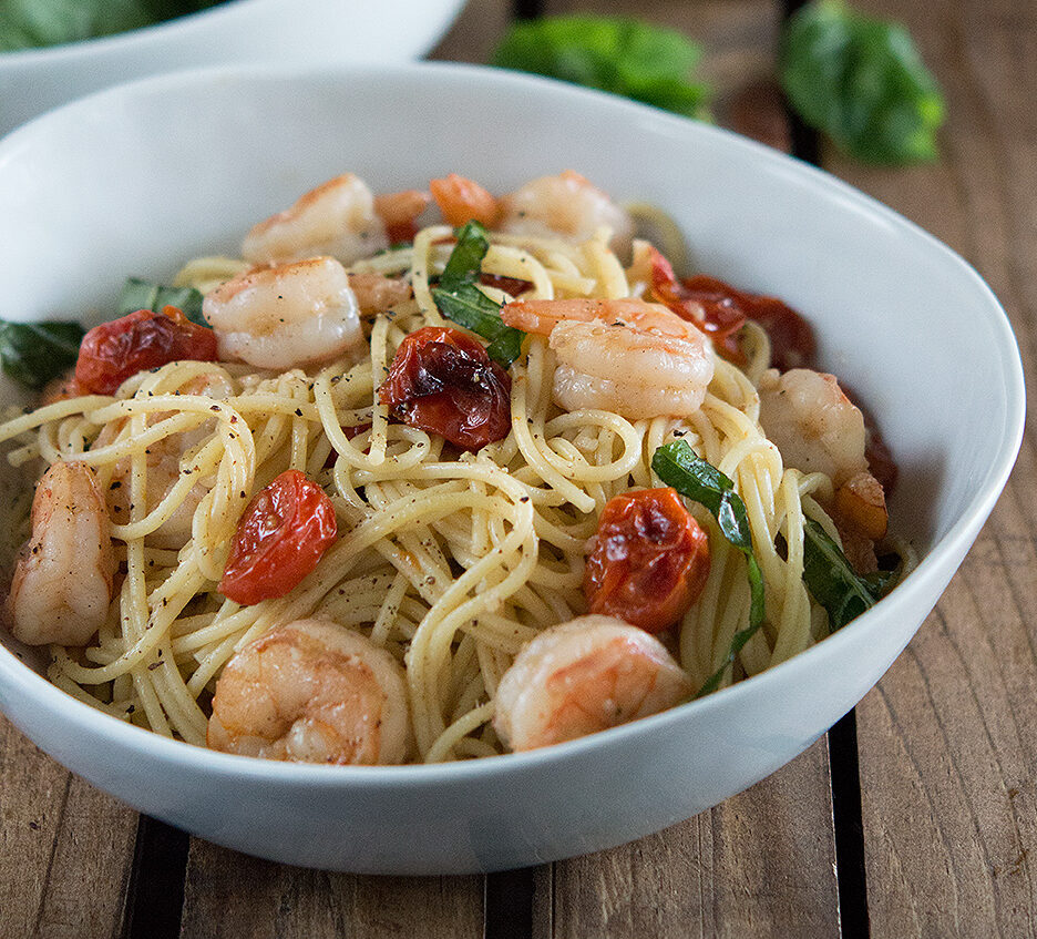 Shrimp and Roasted Tomato Pasta with Garlic Wine Sauce in white bowl