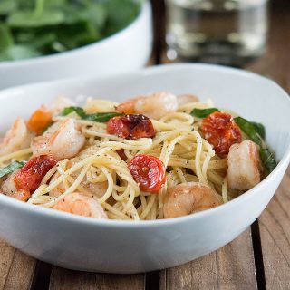 Shrimp and Roasted Tomato Pasta with Garlic Wine Sauce in a big white bowl