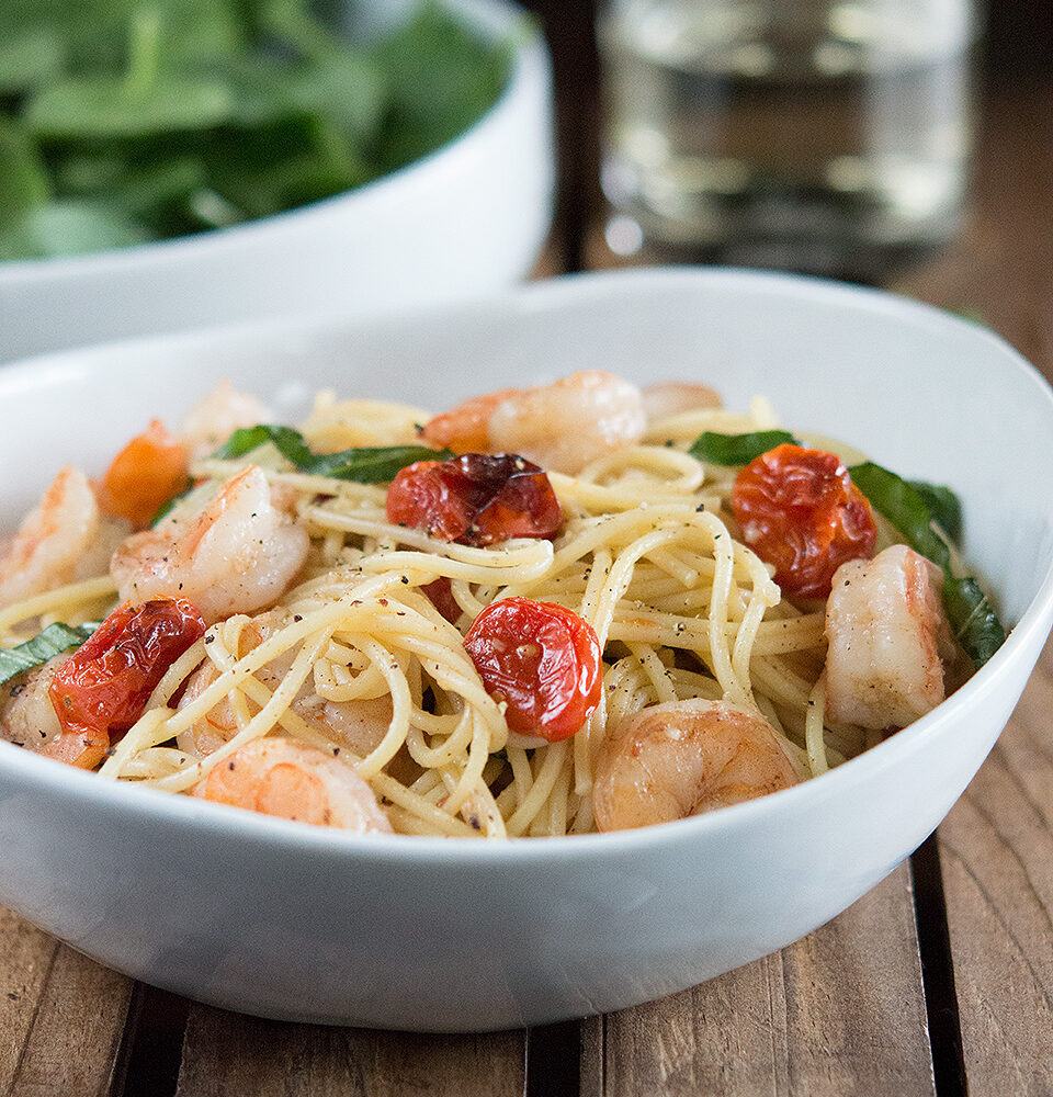 Shrimp and Roasted Tomato Pasta with Garlic Wine Sauce in a big white bowl