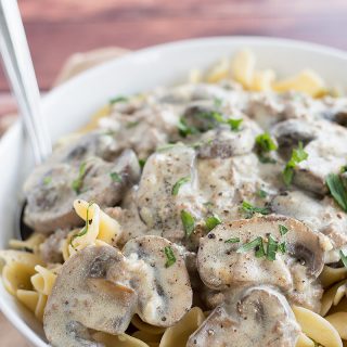 Easy Ground Beef Stroganoff served with a fork in a big white bowl