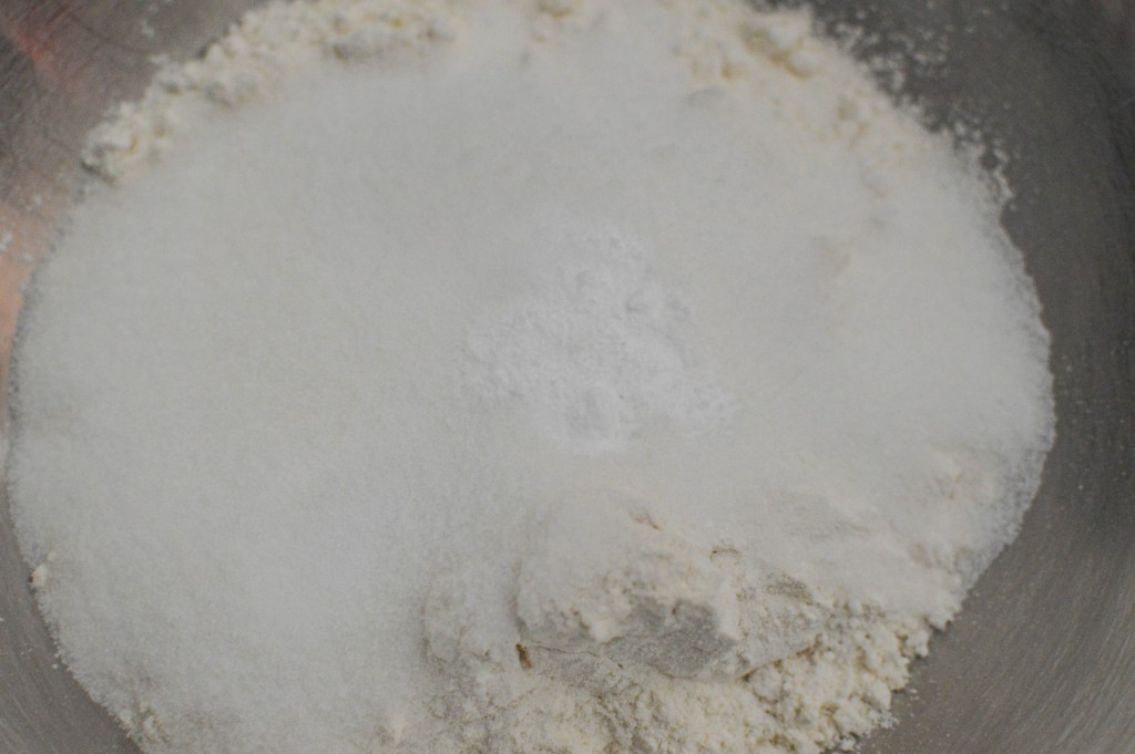 Adding the flour, salt, baking soda, sugar to the mixing bowl