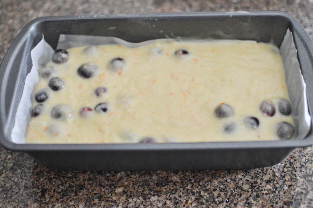 A loaf pan full of the batter in it