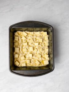 Pizza Dough and Cubed Cheese In Pan