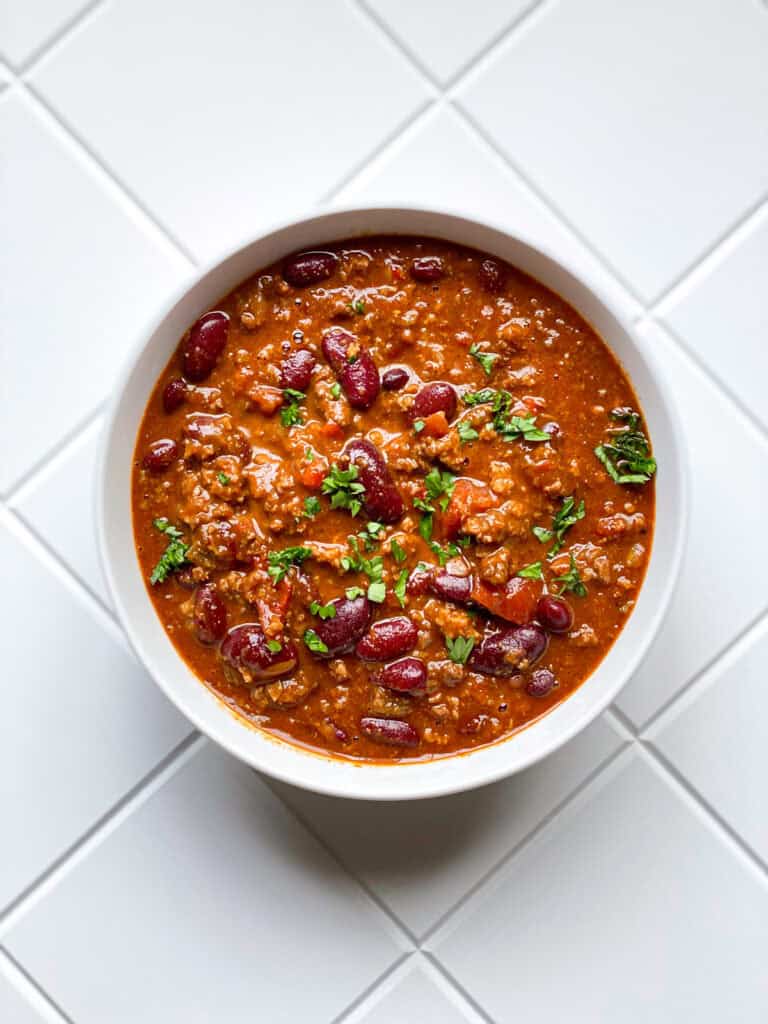 Bowl of chili on white counter top