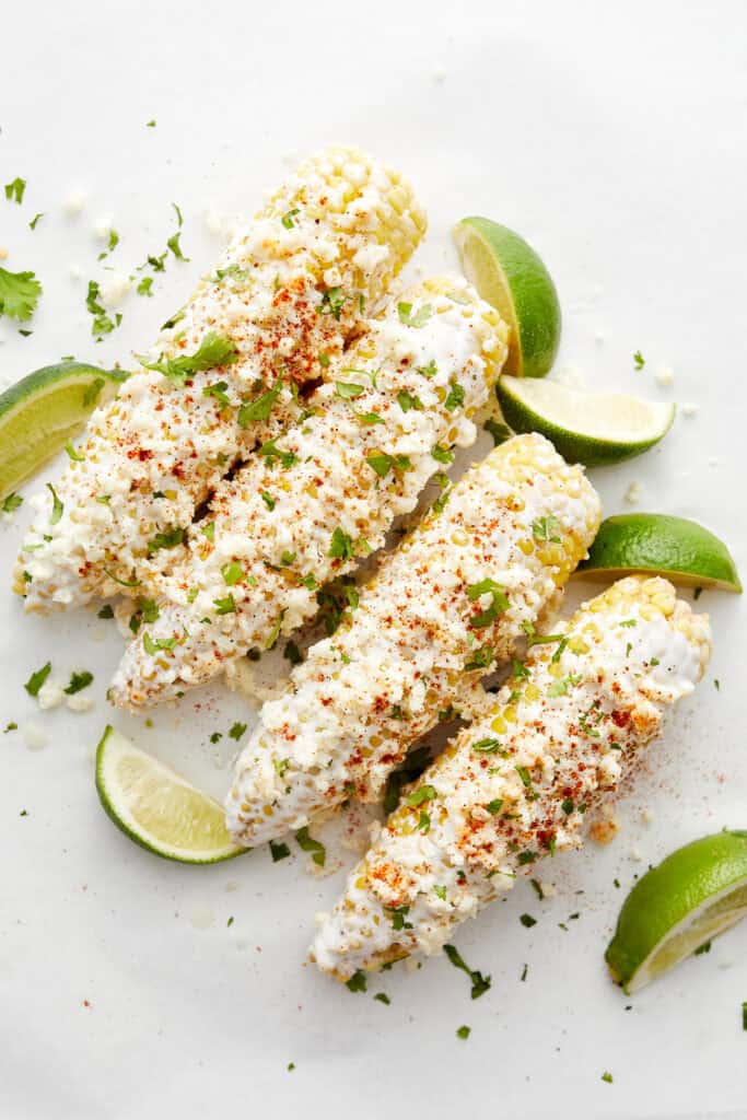 Corn with limes on white top