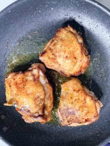 Browned Chicken Thighs In Pan