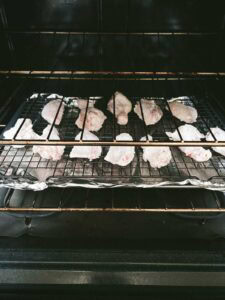 Pan of wings cooking in oven