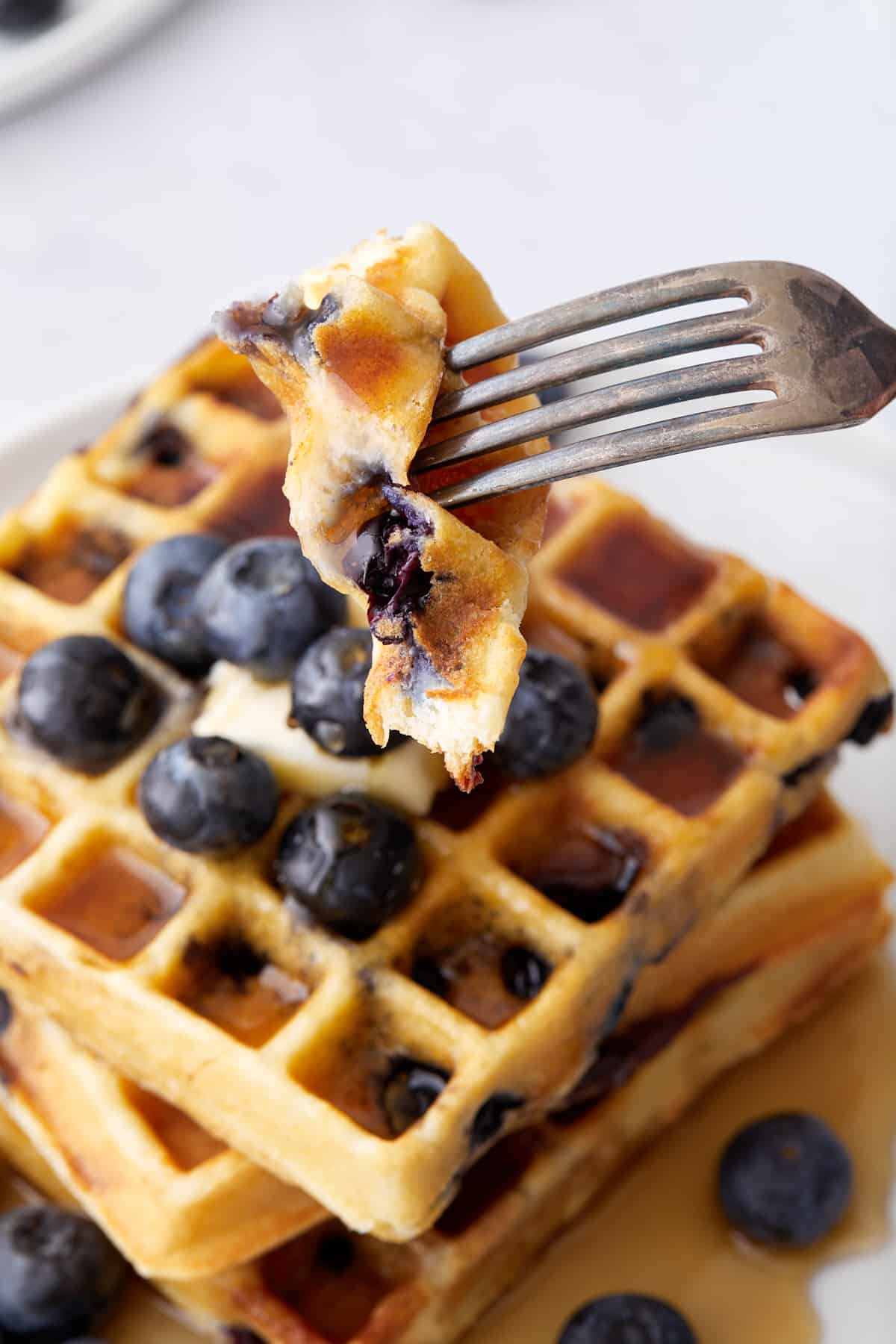 Trying Blueberry Ricotta Waffles with a metal fork