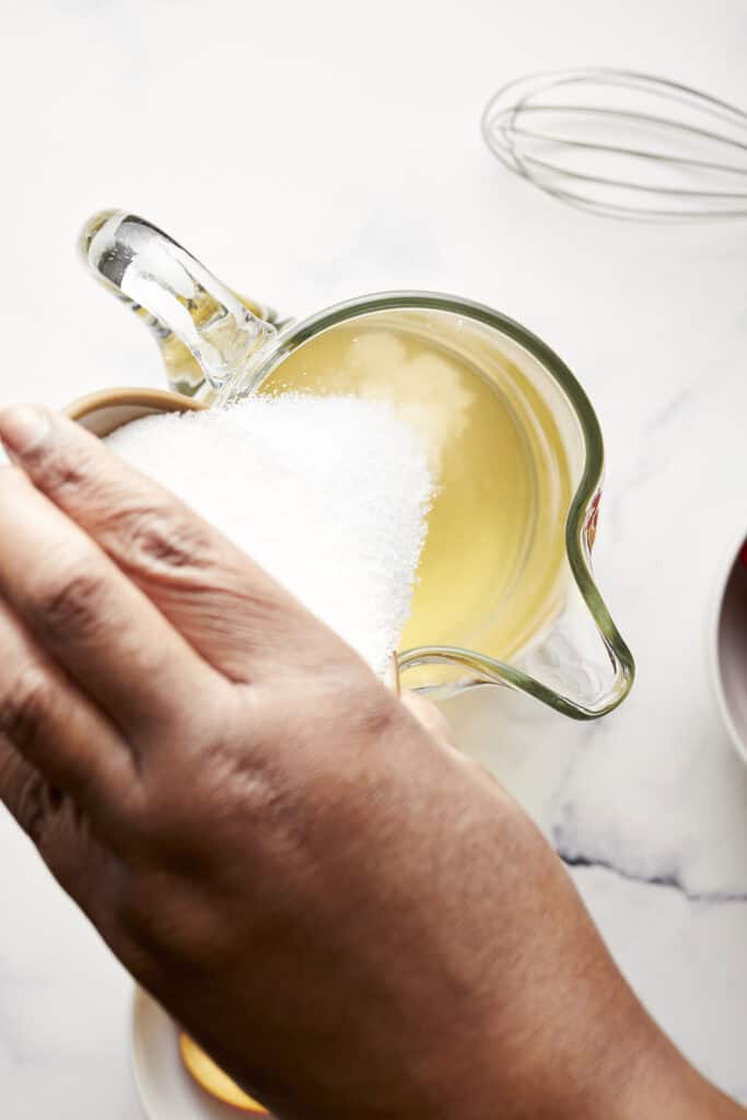 Pouring sugar into pitcher