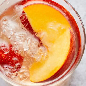 Glass of Sparkling Peach and Strawberry Sangria
