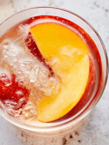 Glass of Sparkling Peach and Strawberry Sangria