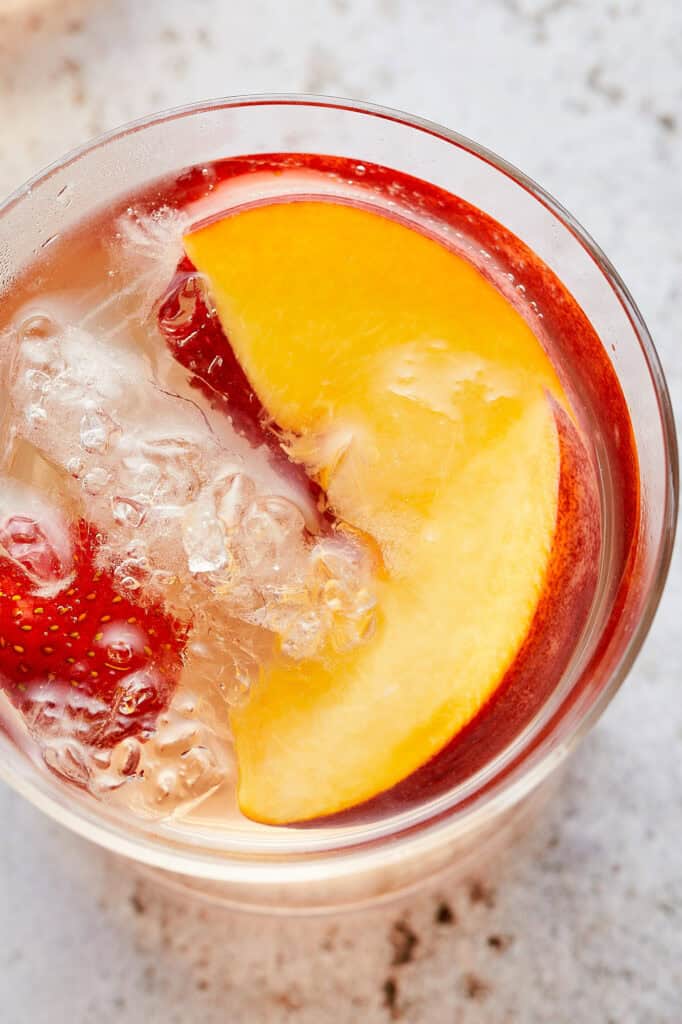 Glass of Sparkling Peach and Strawberry Sangria