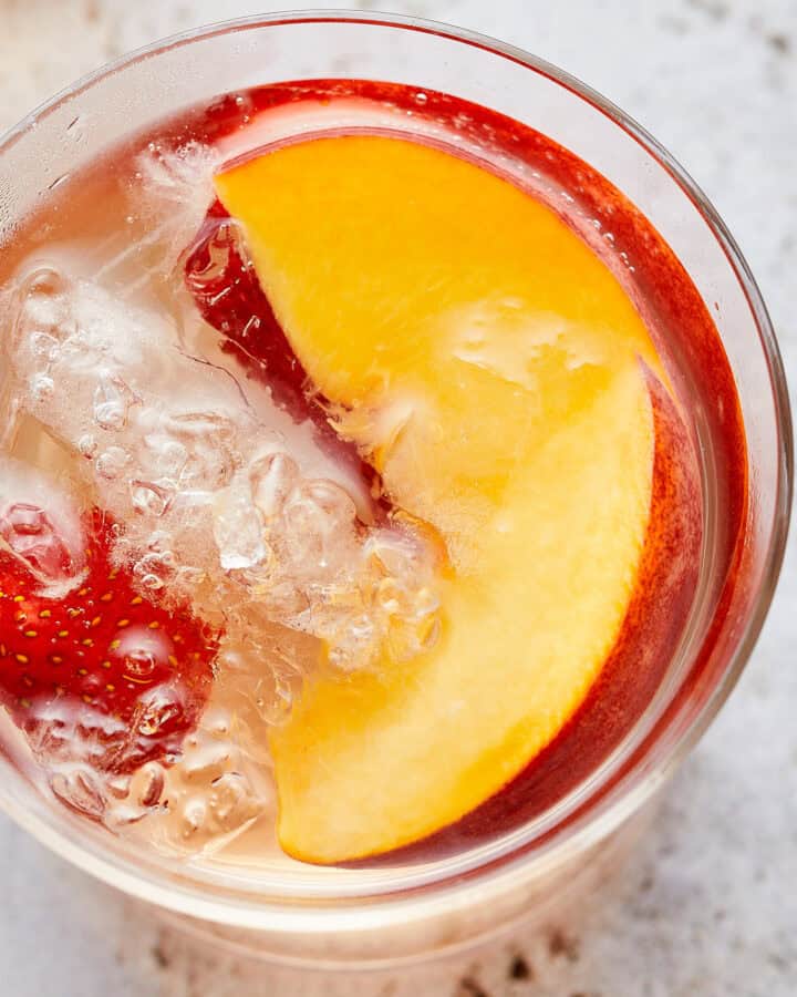 Glass of Sparkling Peach and Strawberry Sangria