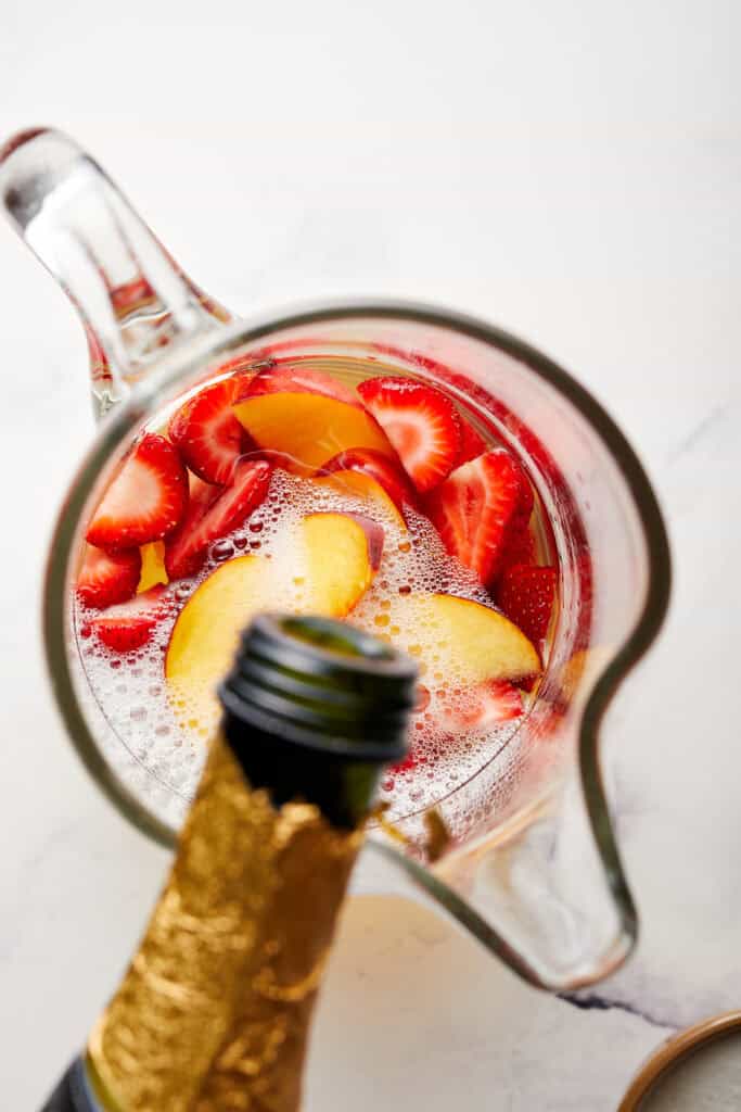 Pouring Champagne into Pitcher