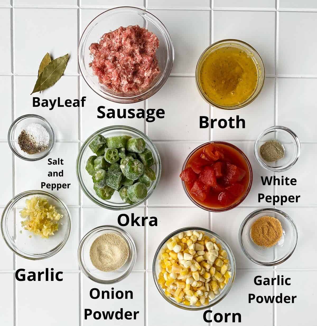 Soup recipe ingredients in clear bowls on white table.