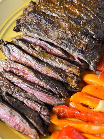 citrus marinated steak on plate with peppers