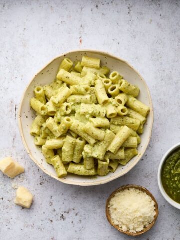 bowls of pasta cheese and pesto