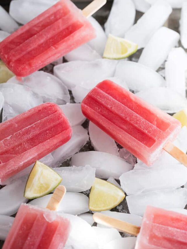 watermelon margarita popsicles on ice with limes