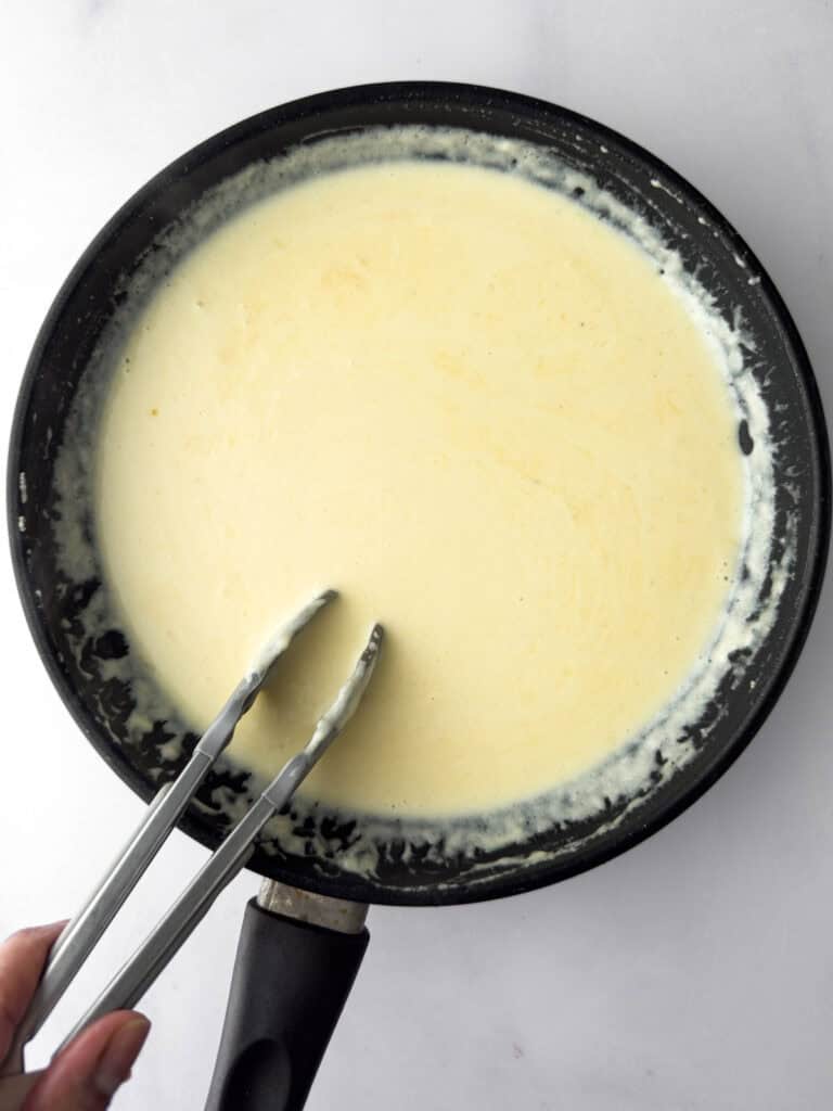 Havarti Cheese Sauce cooking in pan. 