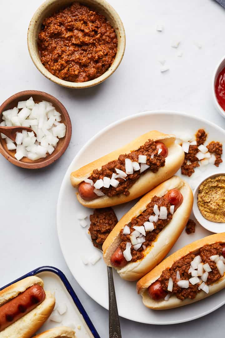 Overhead on the delicious and easy Homemade Hot Dog Chili served in hot dogs on a white plate