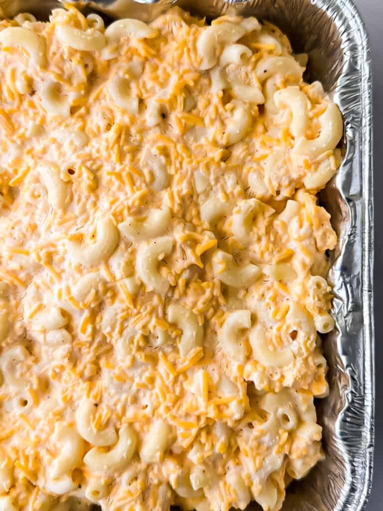 Thawed uncooked macaroni and cheese in foil pan