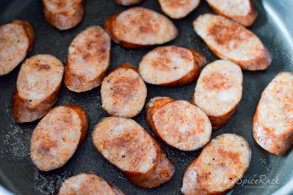 Another process shot showing cooking the sausage in the pan