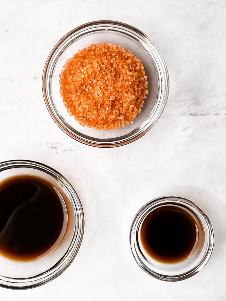 Bowls of liquid smoke and Hawaiian sea salt