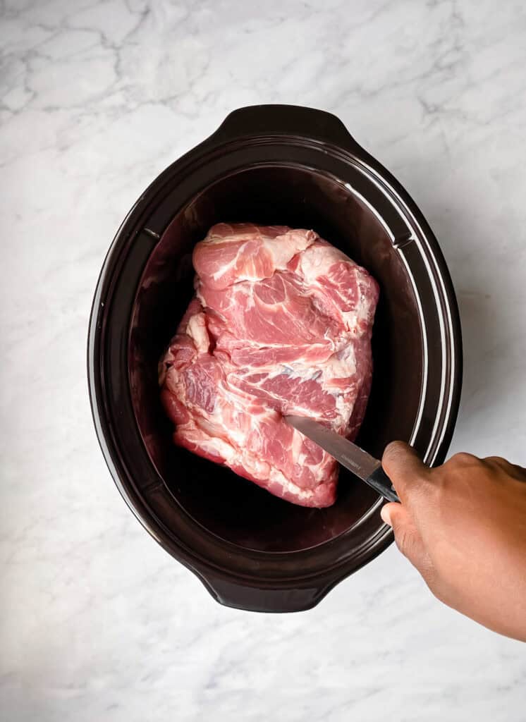 poking holes in pork in slow cooker